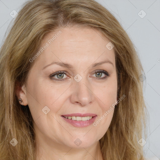 Joyful white adult female with long  brown hair and green eyes