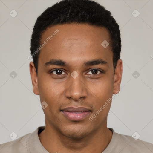 Joyful black young-adult male with short  black hair and brown eyes