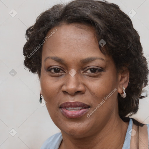 Joyful black adult female with short  brown hair and brown eyes