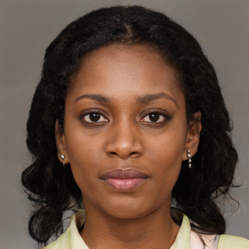 Neutral black young-adult female with medium  black hair and brown eyes