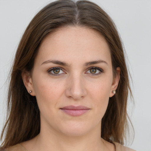 Joyful white young-adult female with medium  brown hair and grey eyes