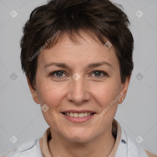 Joyful white adult female with medium  brown hair and brown eyes