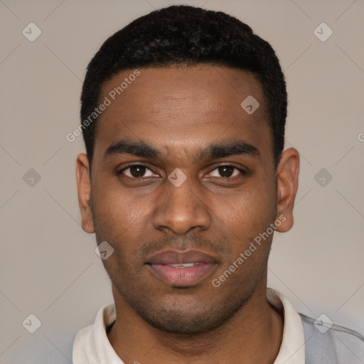 Joyful black young-adult male with short  black hair and brown eyes