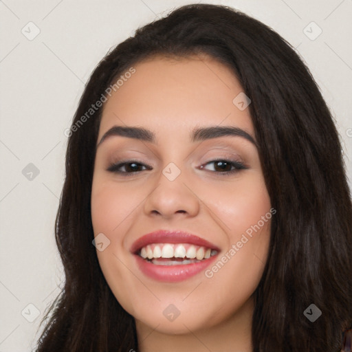 Joyful white young-adult female with long  black hair and brown eyes