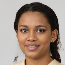 Joyful black young-adult female with medium  brown hair and brown eyes