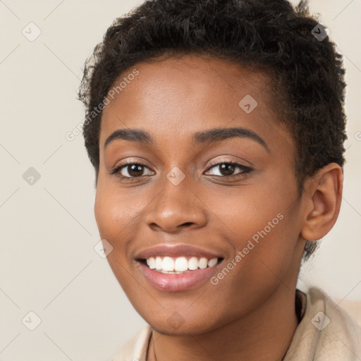 Joyful black young-adult female with short  brown hair and brown eyes