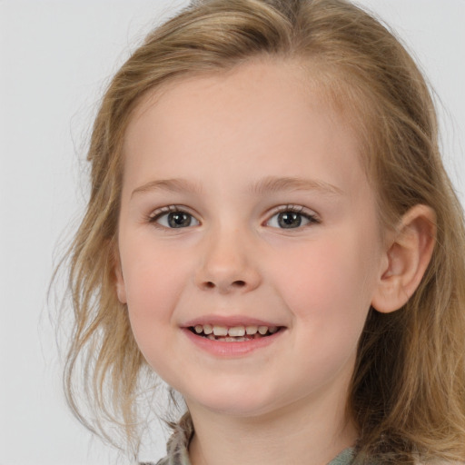 Joyful white child female with medium  brown hair and brown eyes