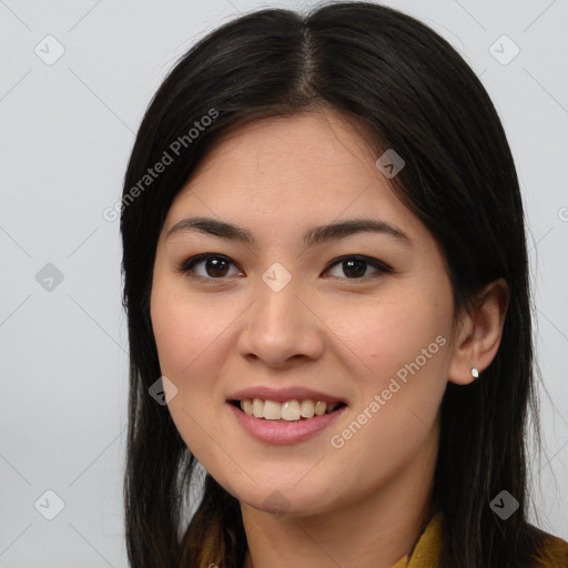 Joyful asian young-adult female with long  brown hair and brown eyes