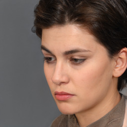 Neutral white young-adult female with short  brown hair and brown eyes