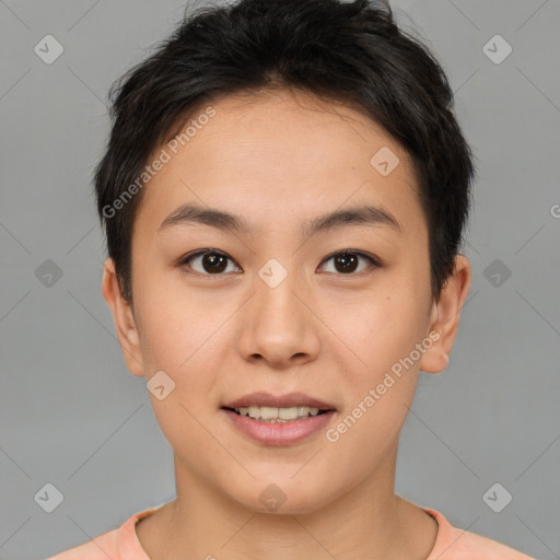 Joyful asian young-adult female with short  brown hair and brown eyes