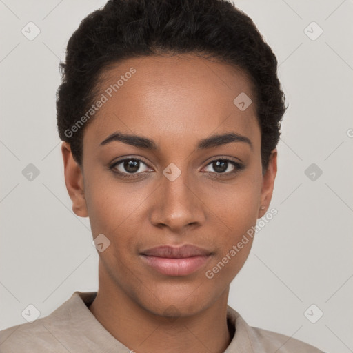 Joyful black young-adult female with short  brown hair and brown eyes