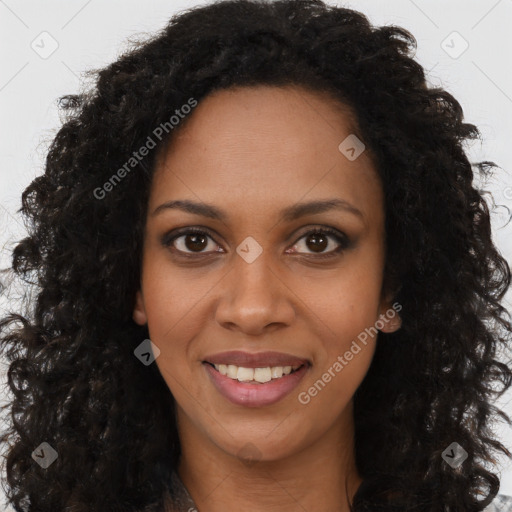 Joyful black young-adult female with long  brown hair and brown eyes