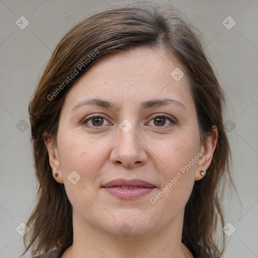 Joyful white adult female with medium  brown hair and grey eyes