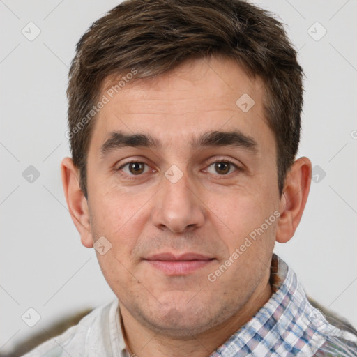 Joyful white adult male with short  brown hair and brown eyes