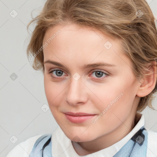 Joyful white child female with medium  brown hair and blue eyes