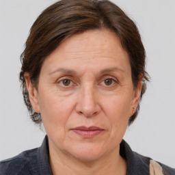 Joyful white middle-aged female with short  brown hair and brown eyes