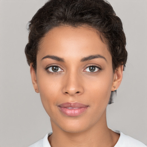 Joyful white young-adult female with short  brown hair and brown eyes