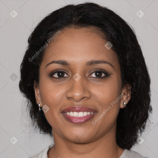 Joyful black young-adult female with medium  brown hair and brown eyes