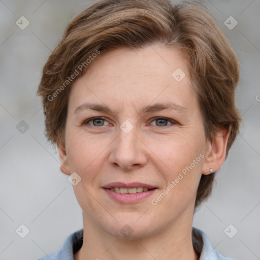 Joyful white adult female with short  brown hair and grey eyes