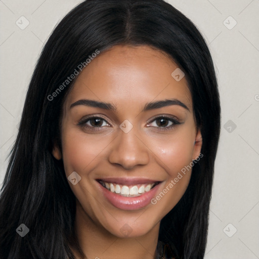 Joyful latino young-adult female with long  brown hair and brown eyes