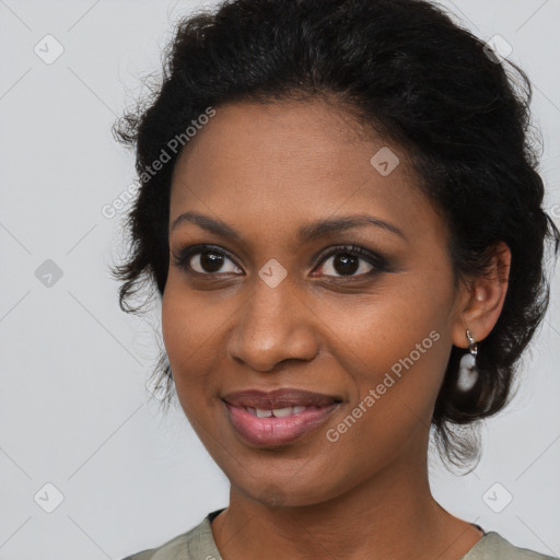 Joyful black young-adult female with medium  brown hair and brown eyes