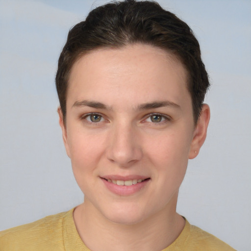 Joyful white young-adult female with short  brown hair and brown eyes