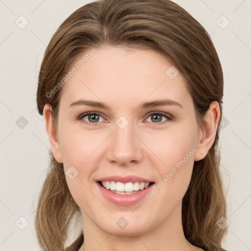 Joyful white young-adult female with medium  brown hair and green eyes