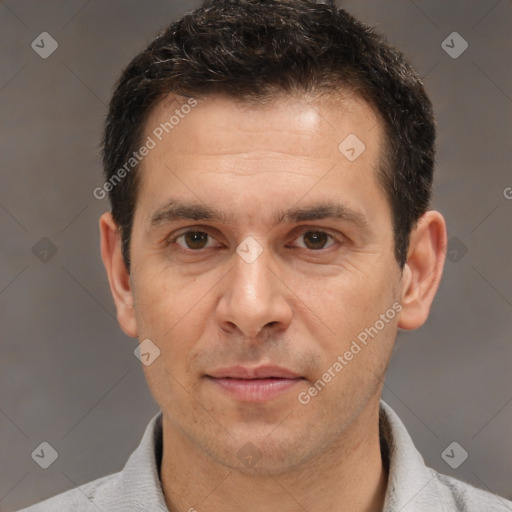 Joyful white adult male with short  brown hair and brown eyes