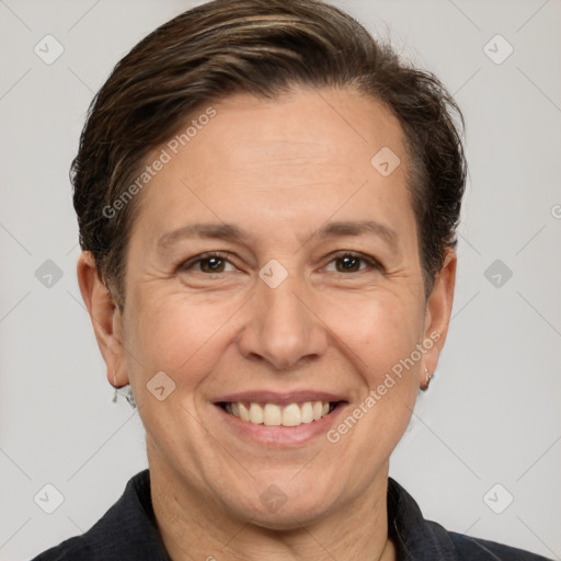 Joyful white adult female with short  brown hair and grey eyes