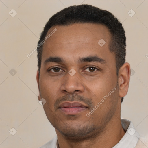 Neutral latino young-adult male with short  black hair and brown eyes