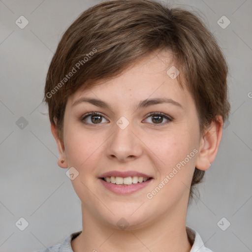 Joyful white young-adult female with short  brown hair and grey eyes