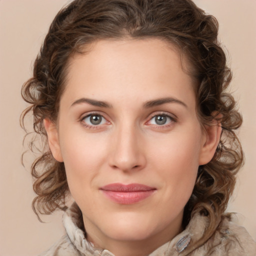 Joyful white young-adult female with medium  brown hair and green eyes