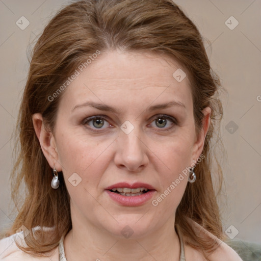 Joyful white adult female with medium  brown hair and blue eyes