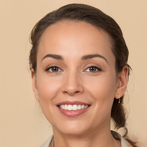 Joyful white young-adult female with medium  brown hair and brown eyes