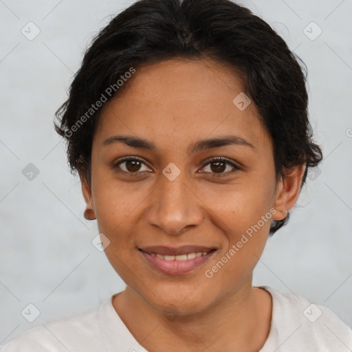 Joyful latino young-adult female with short  brown hair and brown eyes