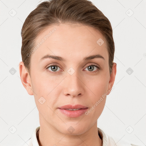 Joyful white young-adult female with short  brown hair and grey eyes