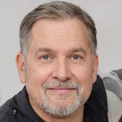 Neutral white middle-aged male with short  gray hair and brown eyes