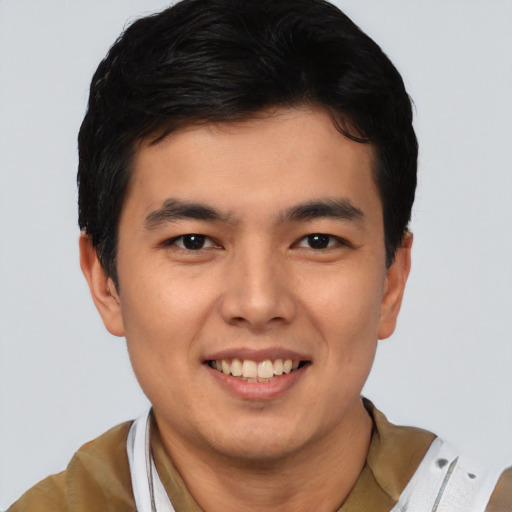 Joyful asian young-adult male with short  black hair and brown eyes