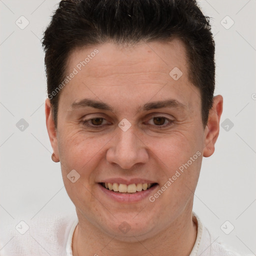 Joyful white adult male with short  brown hair and brown eyes