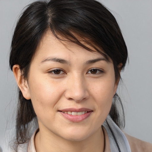 Joyful white young-adult female with medium  brown hair and brown eyes