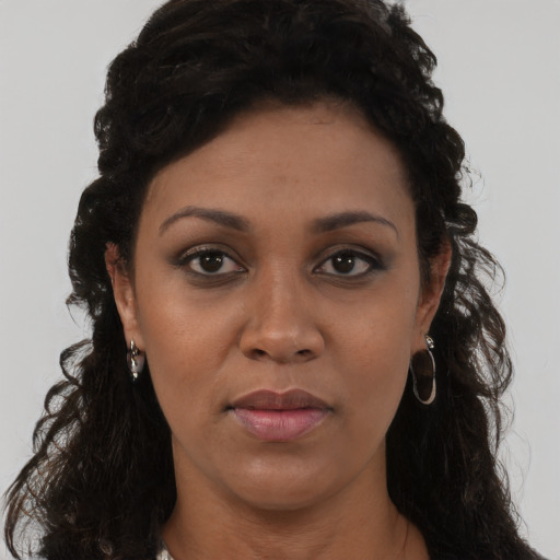 Neutral black young-adult female with long  brown hair and brown eyes