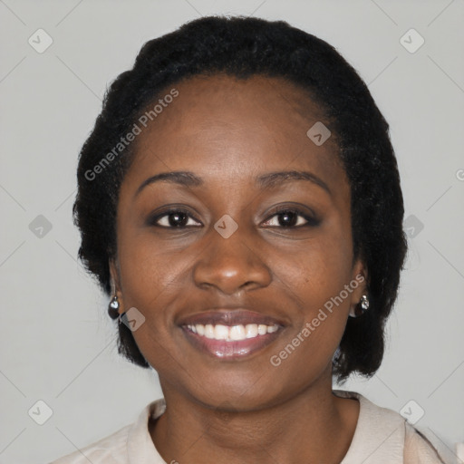 Joyful black young-adult female with medium  black hair and brown eyes