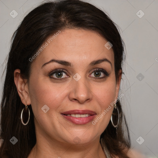 Joyful white adult female with long  brown hair and brown eyes