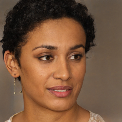 Joyful latino young-adult female with short  brown hair and brown eyes