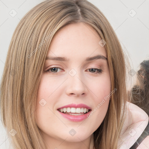 Joyful white young-adult female with medium  brown hair and green eyes