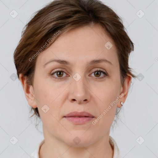 Joyful white adult female with short  brown hair and grey eyes