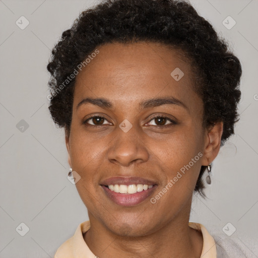 Joyful black young-adult female with short  brown hair and brown eyes