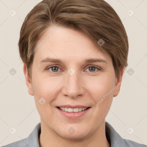 Joyful white young-adult female with short  brown hair and grey eyes