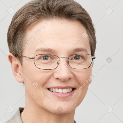 Joyful white adult female with short  brown hair and grey eyes