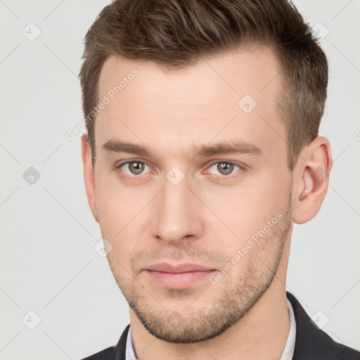 Neutral white young-adult male with short  brown hair and grey eyes